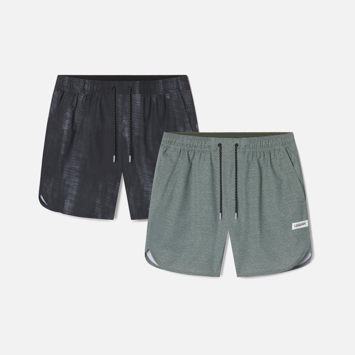 Two athletic shorts in charcoal and sage green with drawstring waists and curved side seams.