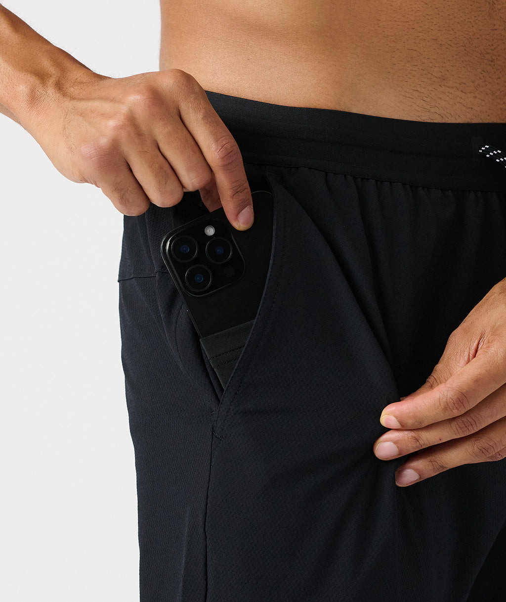 Black pants with zippered pocket displaying phone camera access feature. - 5