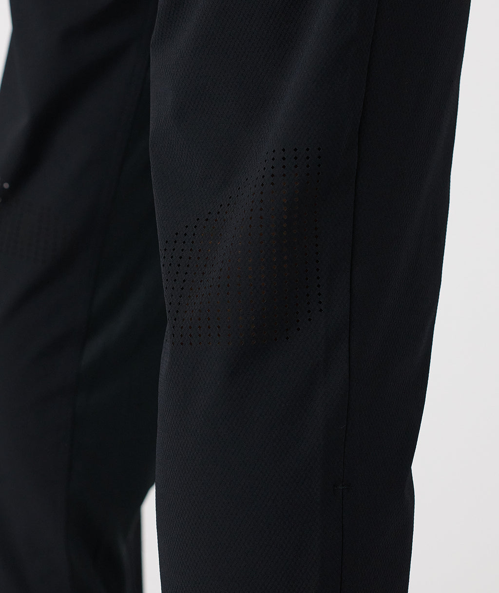 Black pant with textured fabric and perforated ventilation panel on thigh. - 4