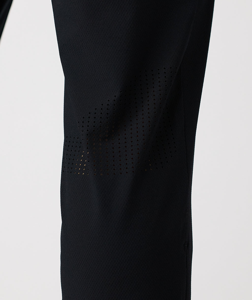 Black pant with perforated mesh panels along the thighs and lower legs. - 7